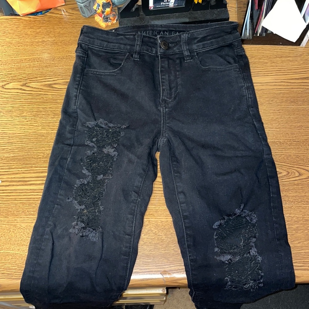 black ripped american eagle jeans